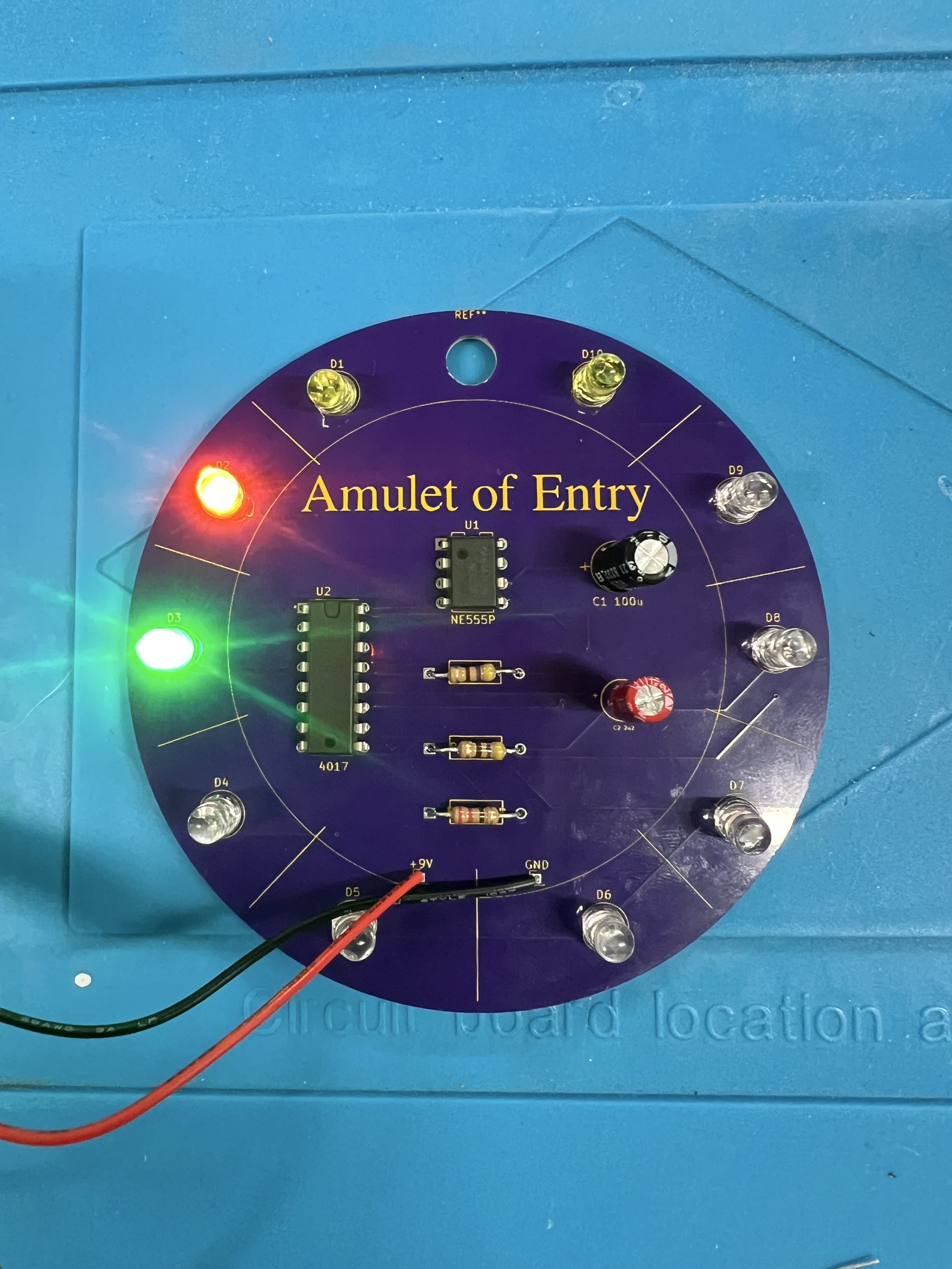 The completed Amulet of Entry PCB with LEDs lit