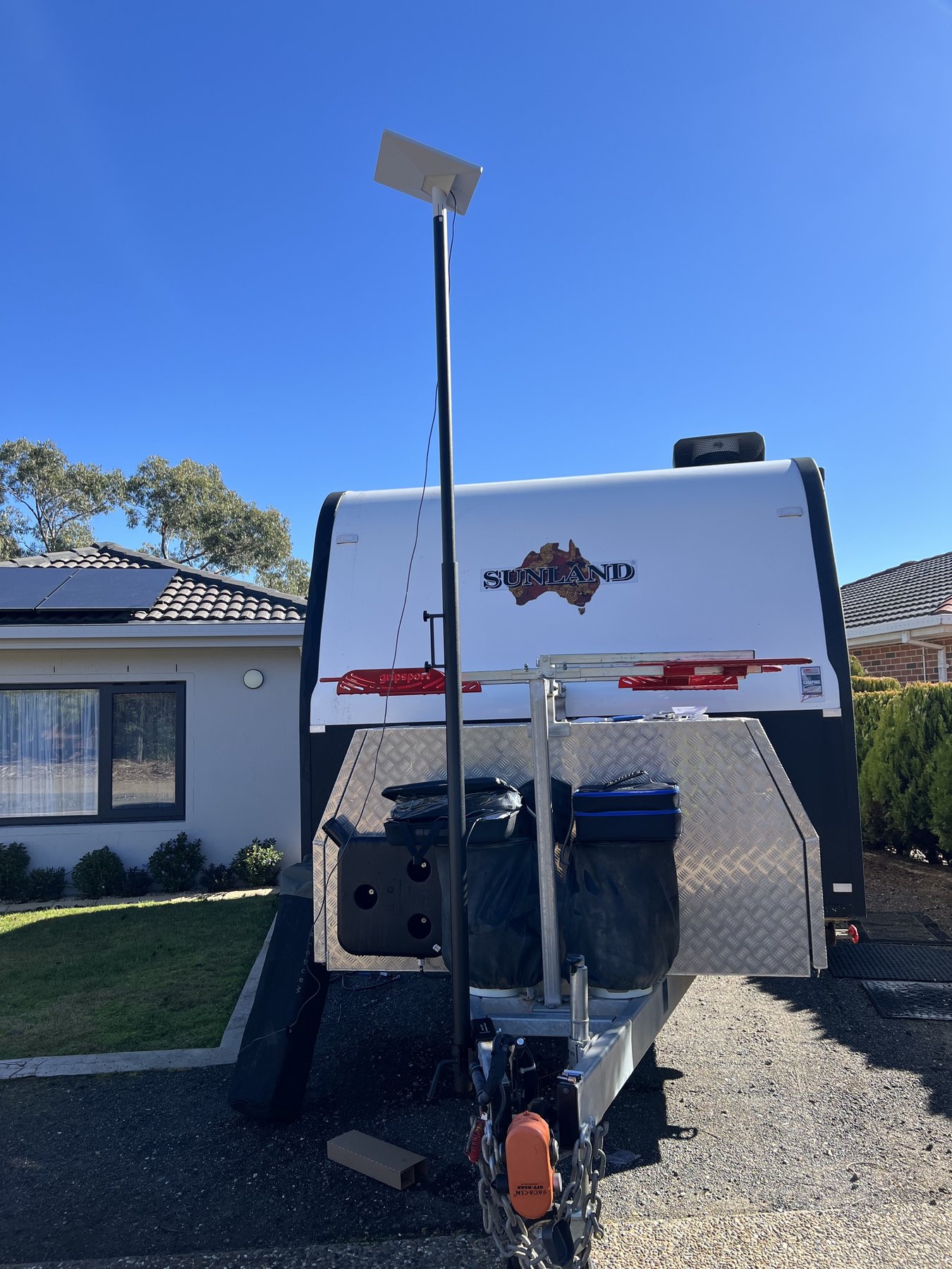The Starlink Mini mounted above the caravan on the telescopic BBQARM pole