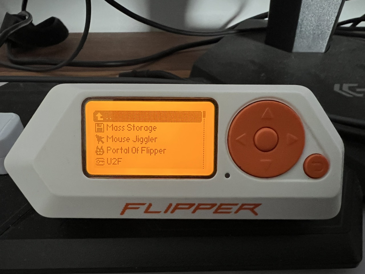 Flipper Zero application menu showing Mass Storage, Mouse Jiggler, Portal Of Flipper and U2F