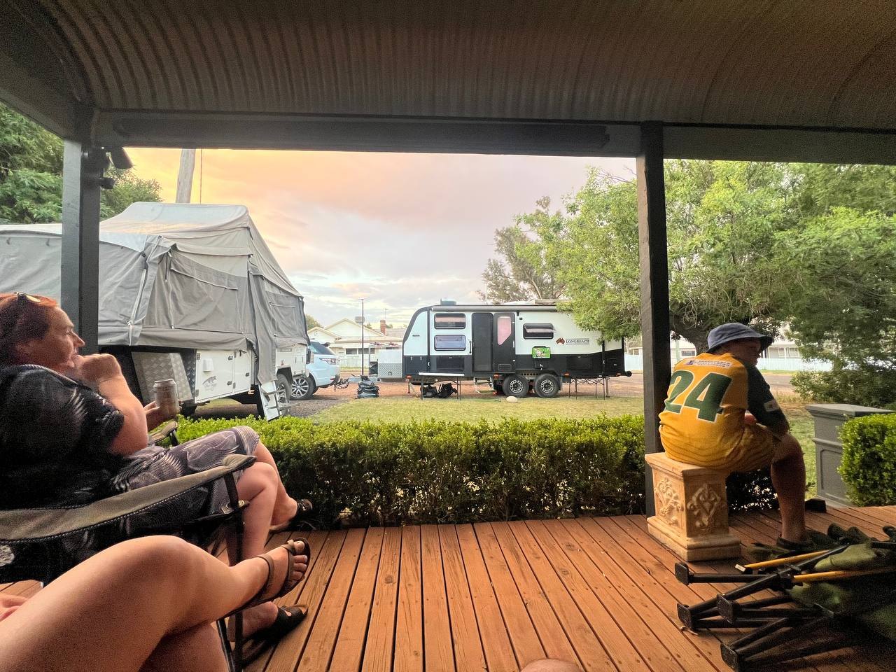 Sunset drinks on the deck, with the Longreach and a camper trailer parked below